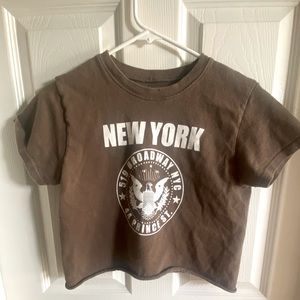 Brown New York crop top from Brandy Melville.